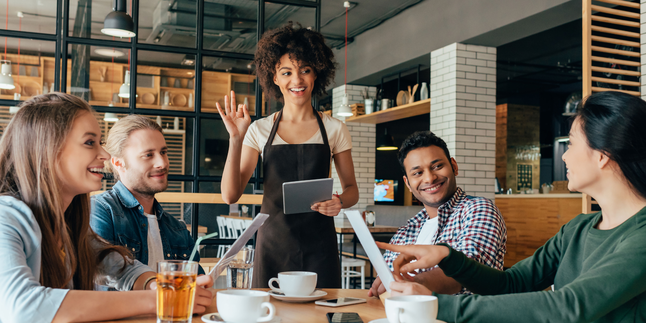 woman server greets table